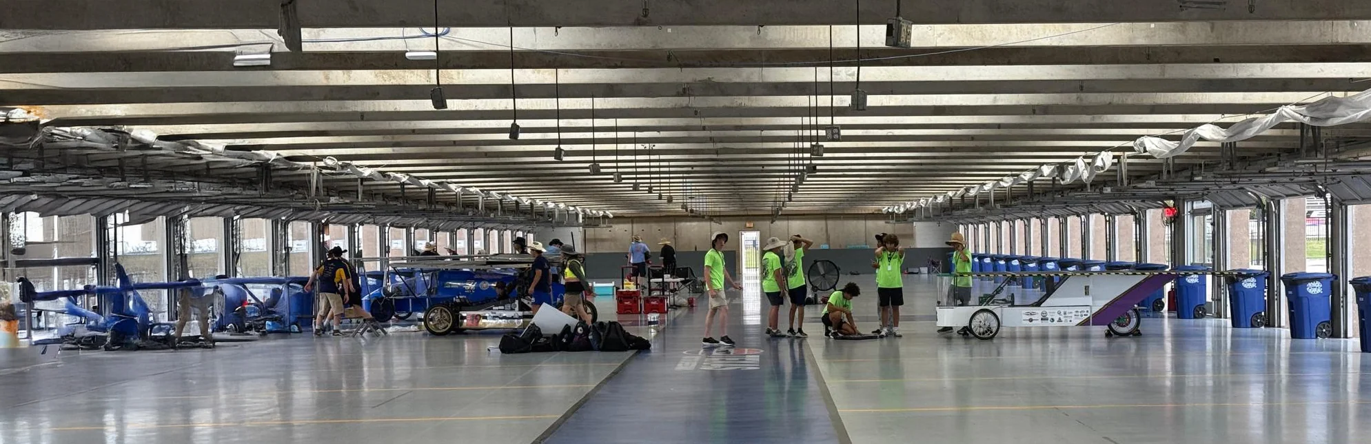 ALSET Paladins team and solar car inside the Texas Motor Speedway garage