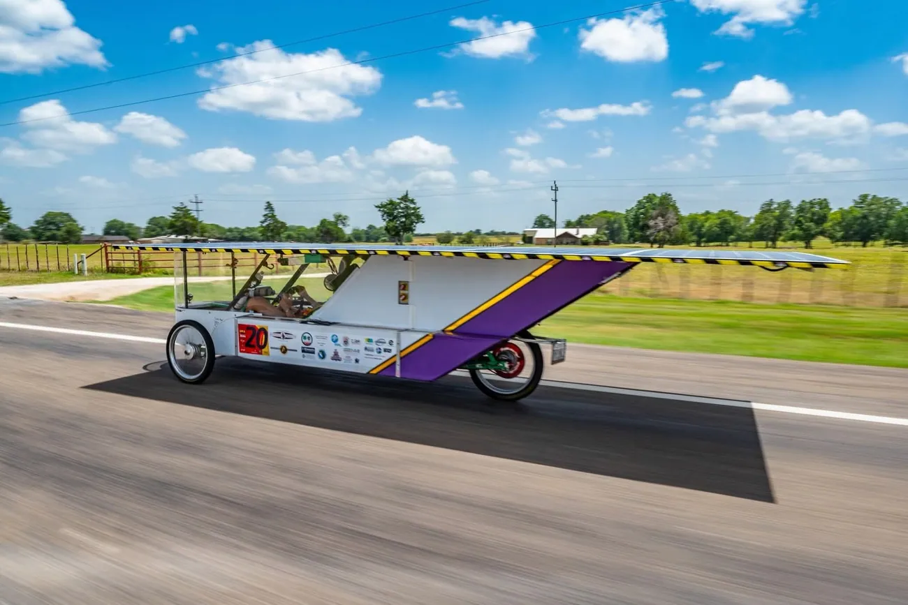 Student-built solar vehicle driving on a Texas highway